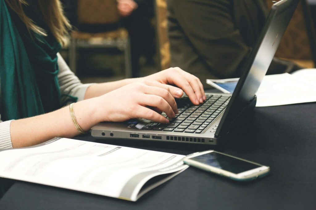 Professional working on a laptop planning digital marketing strategy and website content for a Johannesburg marketing agency